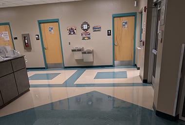 Commercial office corridor with tile floors
